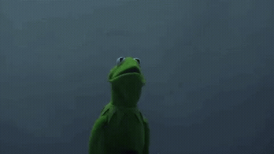 Kermit The Frog Is Standing Next To A Grim Reaper In A Black Hood . GIF