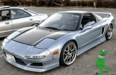 Kermit The Frog Is Standing Next To A Sports Car GIF