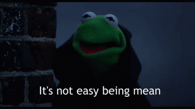 Kermit The Frog Says It 'S Not Easy Being Mean While Standing Next To A Brick Wall GIF