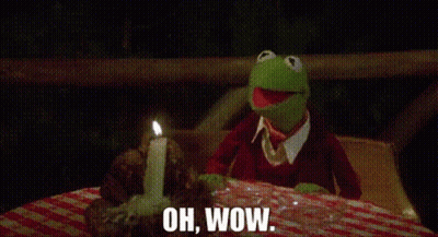 Kermit The Frog Sitting At Table With Candle Saying Oh Wow GIF