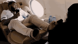 Kevin Gates Gets Foot Massage On Flight GIF