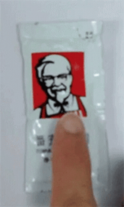 KFC Bag With Man Wearing Sunglasses And Earbuds GIF
