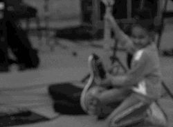 Kid Holding A Guitar