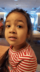 Kid In Restaurant Eye Brow Raise GIF