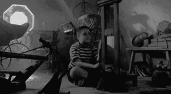 Kid Playing With A Guillotine  GIF