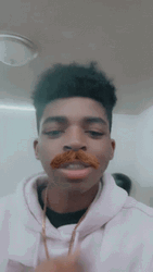 Kid Showing Fake Walrus Mustache GIF