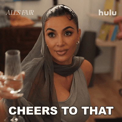 Kim Kardashian Holding Champagne Cheers