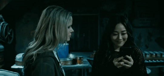 Kimiko Showing Message To A Friend GIF