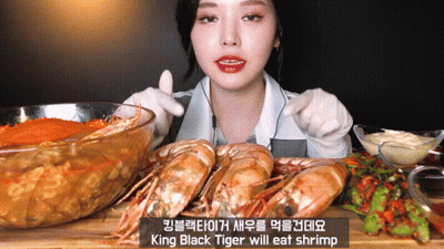 King Black Tiger Will Eat Shrimp On Cutting Board GIF