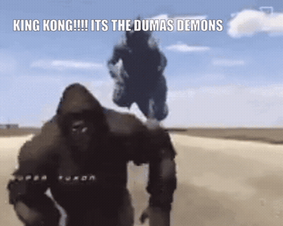King Kong And Godzilla Are Walking Down A Dirt Road In The Desert . GIF