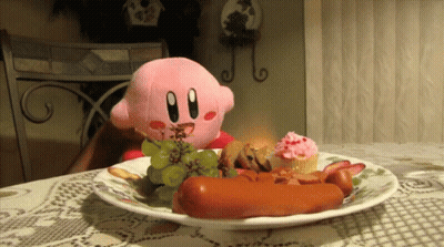 Kirby Eating Plate Of Grapes Hot Dogs And Cupcakes GIF