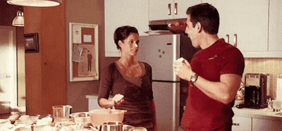 Kitchen With Clock Above Stove And Bosch Appliance GIF