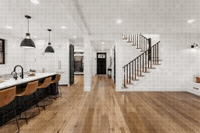 Kitchen With Hardwood Floors, Staircase, Bar GIF