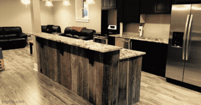 Kitchen With Stainless Steel Appliances And Wooden Counter GIF