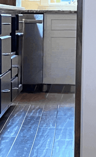 Kitchen With Stainless Steel Cabinets And Black Tiled Floor GIF