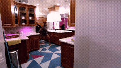 Kitchen With White Cabinets And Washing Machine Label GIF
