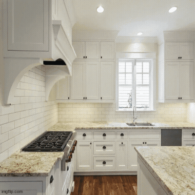 Kitchen With White Cabinets Granite Countertops And Large Window GIF