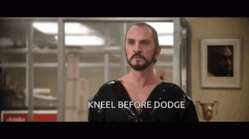 Kneeling Man With Beard And Dodge Words GIF