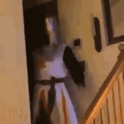 Knight In Armor Standing By Doorway GIF