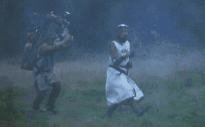 Knight Running In Field With Another Man GIF