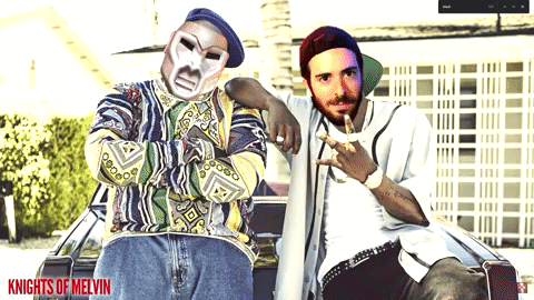 Knights Of Melvin Poster With Two Men Posing GIF