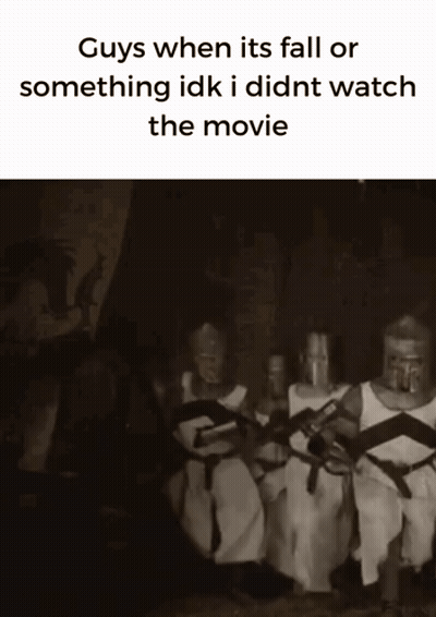 Knights Sitting With Swords In Dark Room GIF
