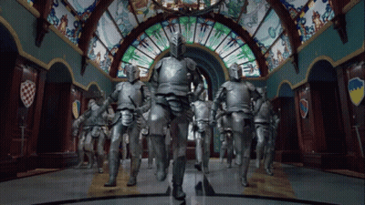 Knights Walking In Hallway With Stained Glass Window GIF