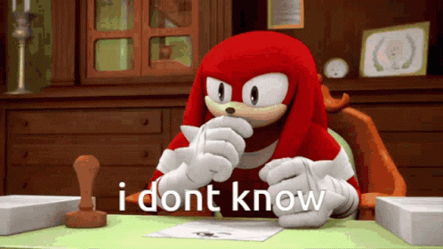 Knuckles The Echidna Sitting At Desk GIF