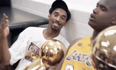 Kobe Bryant And Shaquille O'neal Pose For A Photo While Holding Trophies GIF