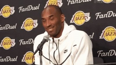 Kobe Bryant Smiling Talking Into Microphone Lakers Wall