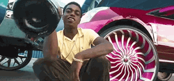 Kodak Black Holding Champagne Bottle With Cars GIF