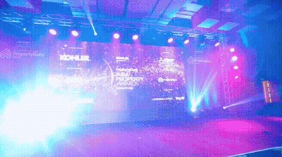 Kohler Property Awards Stage With Purple And Blue Lighting GIF