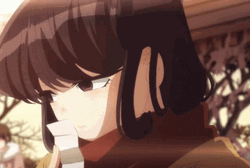 Komi Covering Mouth With Paper GIF