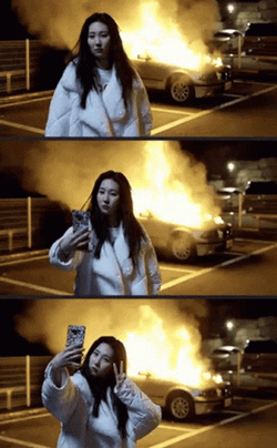 Korean Girl Doing Selfie Of Car Explosion GIF
