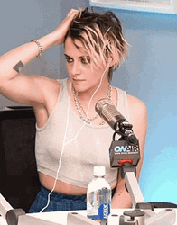 Kristen Stewart Showing Armpit While Seating GIF