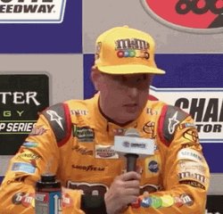 Kyle Busch Tossing Microphone Onto Table GIF