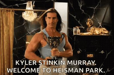 Kyler Stinkin Murray Is Holding A Trophy In A Bathroom And Saying Welcome To Heisman Park . GIF