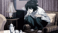 L Death Note Sitting On Couch GIF