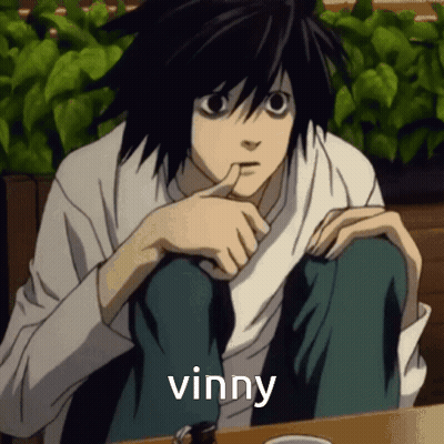 L From Death Note Is Sitting At A Table With His Finger In His Mouth And The Word Vinny Above Him GIF