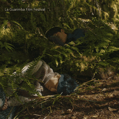 La Guarimba Film Festival Poster Couple Laying In Woods GIF