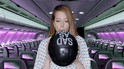 Lady Blowing Balloon GIF