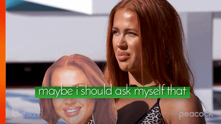 Lady Happily Holding Her Own Reflection GIF