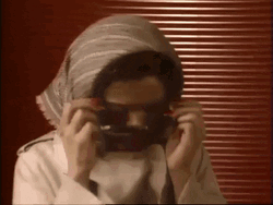 Lady Hiding With Sunglasses GIF