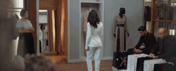 Lady In White Suit Walking Away GIF