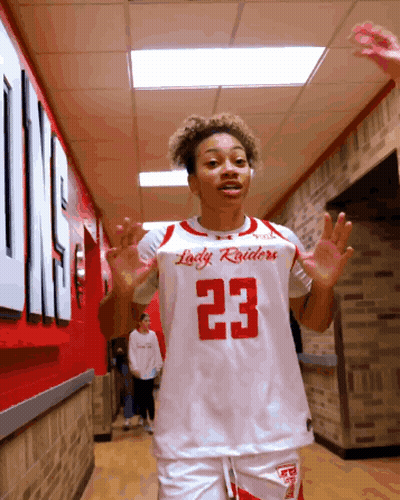 Lady Raiders Basketball Player With Hands In Air GIF