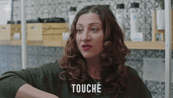Lady Saying Touche While Pointing GIF