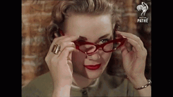 Lady Wearing Vintage Glasses GIF