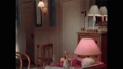 Lamp With Pink Shade On Table GIF