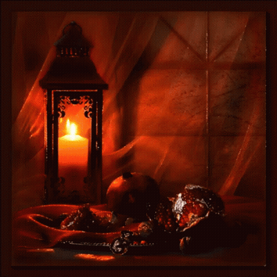 Lantern With Lit Candle On Table GIF