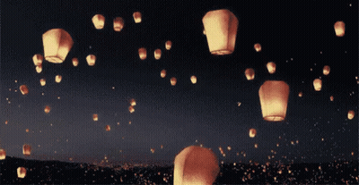 Lanterns Floating In Night Sky GIF
